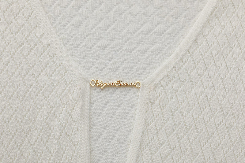 Vague crochet golden logo dress